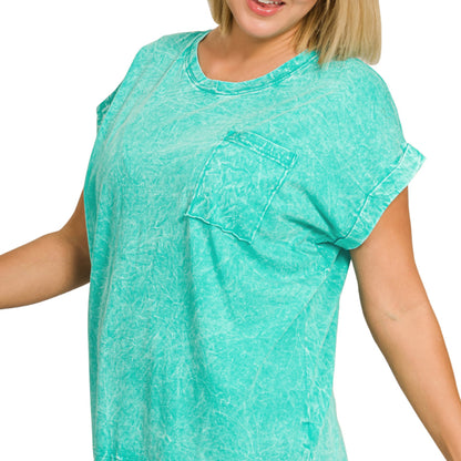 Lifestyle view of the turquoise folded sleeve tee showing the relaxed boutique silhouette.