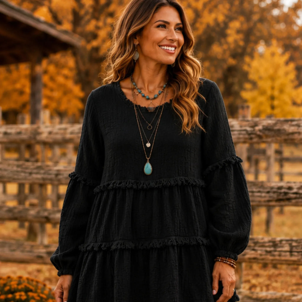 Women's Literary Retro Geometric Long Sleeve Top in Black, front view featuring textured geometric fabric and a relaxed tiered silhouette.