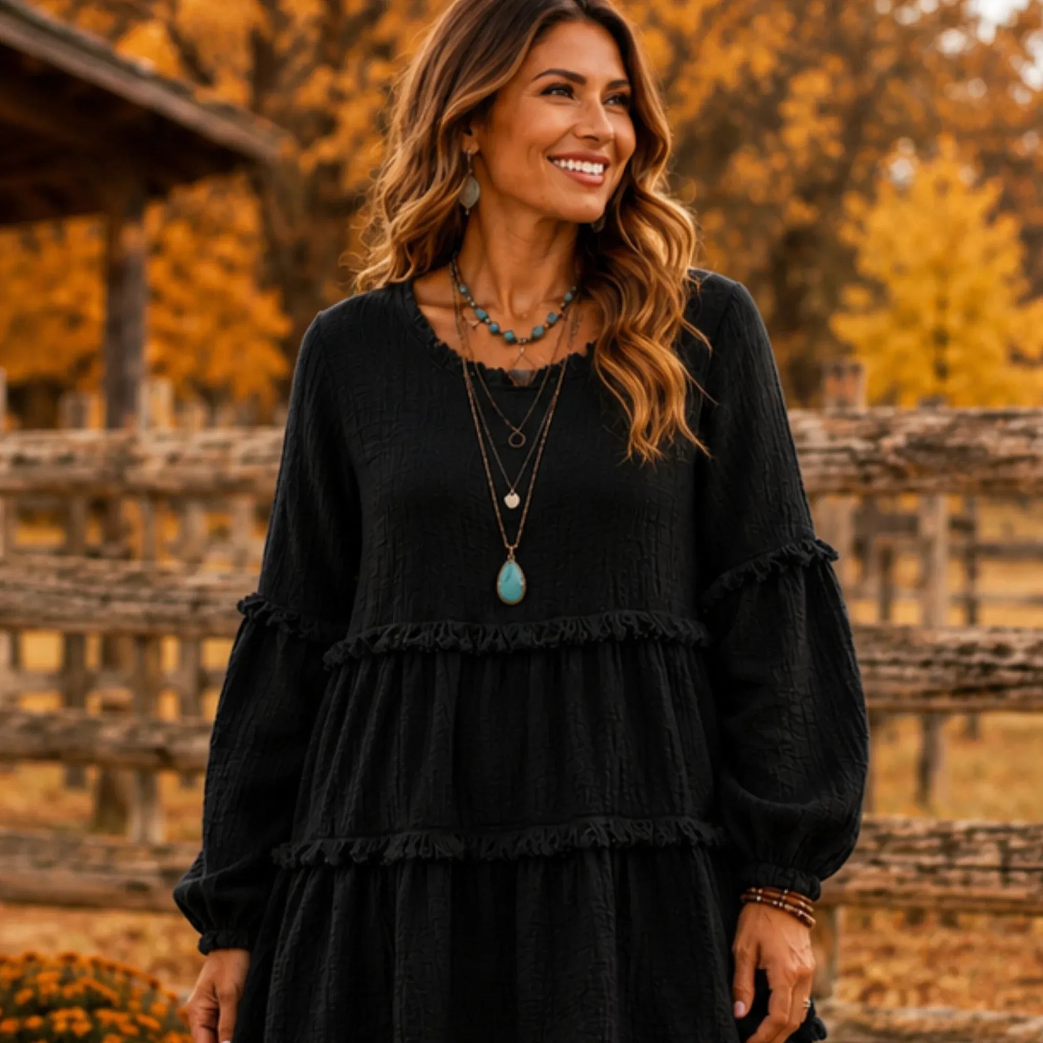 Women's Literary Retro Geometric Long Sleeve Top in Black, front view featuring textured geometric fabric and a relaxed tiered silhouette.