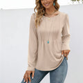 Women's beige long sleeve crew neck essential top with pleated detailing and a soft, relaxed everyday fit.