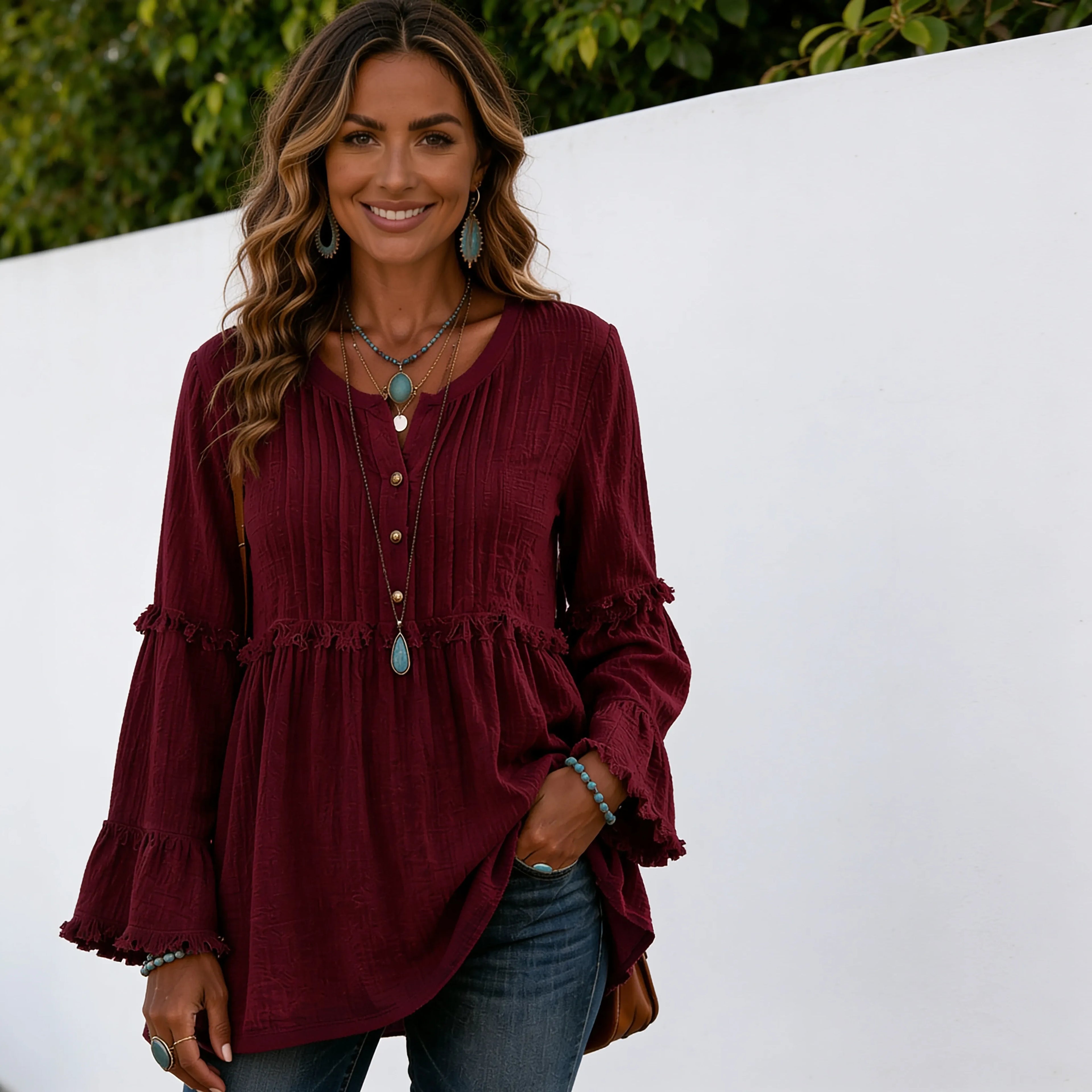Women's wine red long sleeve lace trim top with textured fabric, lace trim detailing, decorative buttons, and relaxed fit.