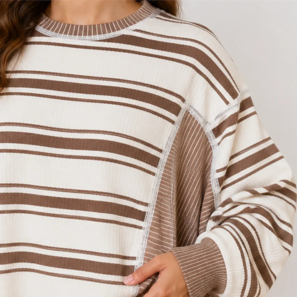Close-up of striped knit fabric and ribbed detail on women's pants set