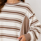 Close-up of striped knit fabric and ribbed detail on women's pants set