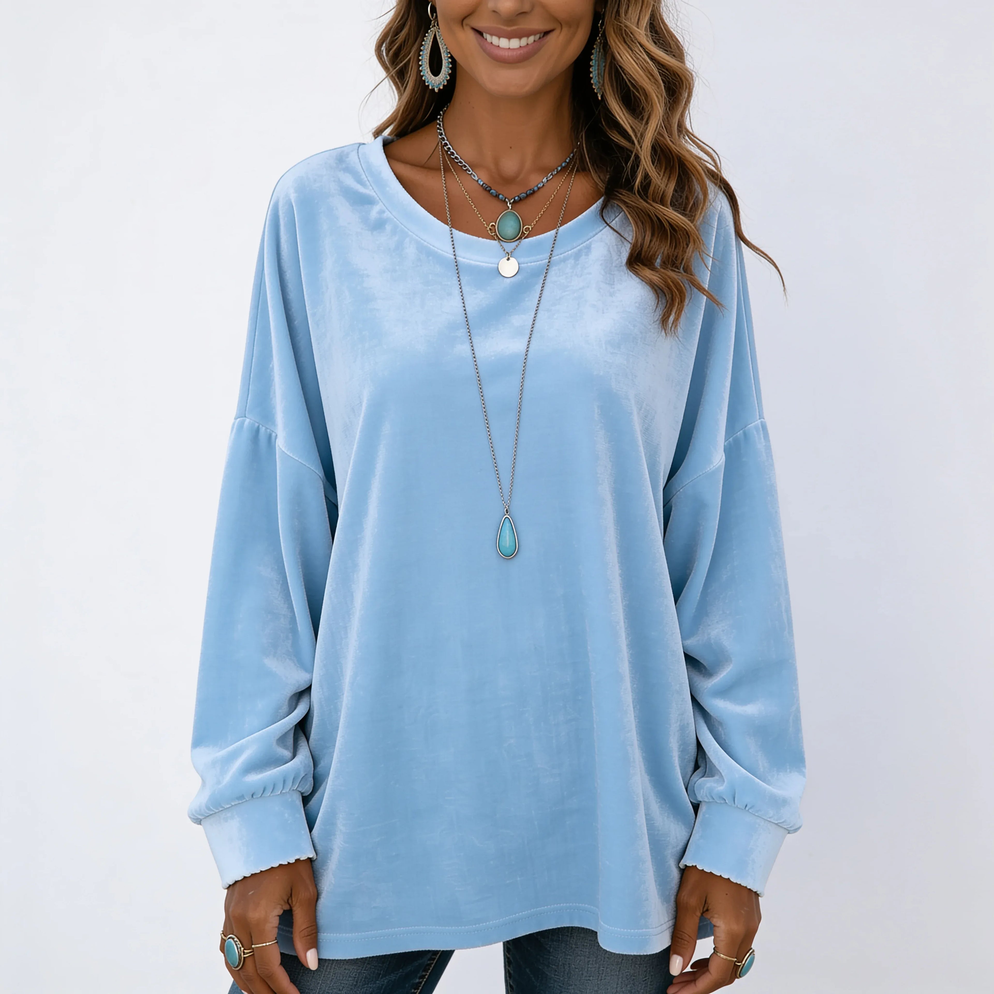 Women's light blue long sleeve velvet solid color top with relaxed fit and crew neckline.