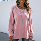 Women's pink long sleeve velvet solid color top with a relaxed fit and luxurious velvet finish.