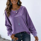 Women's purple long sleeve velvet solid color top featuring a relaxed fit and soft velvet texture.