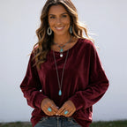 Women's wine red long sleeve velvet solid color top with a soft velvet finish and relaxed silhouette.