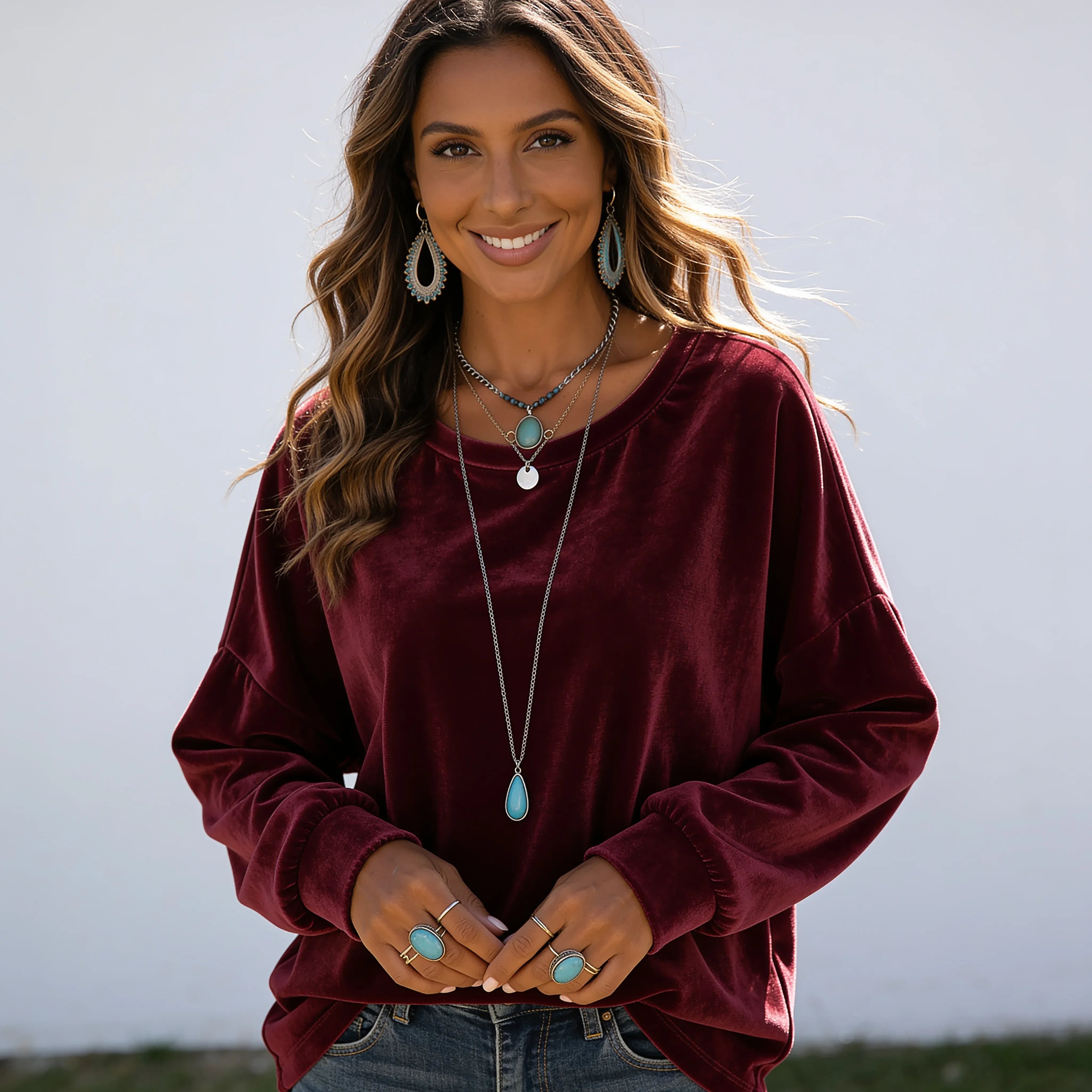 Women's wine red long sleeve velvet solid color top with a soft velvet finish and relaxed silhouette.