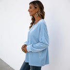 Side view of the women's light blue velvet long sleeve top showing the relaxed silhouette and dropped shoulders.