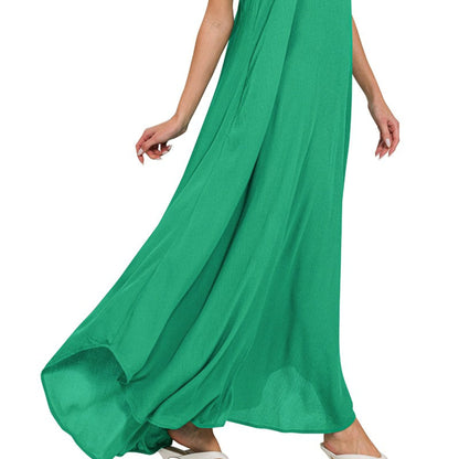 Human lifestyle photo of the Zenana K green dress being worn in a bright, natural coastal setting.