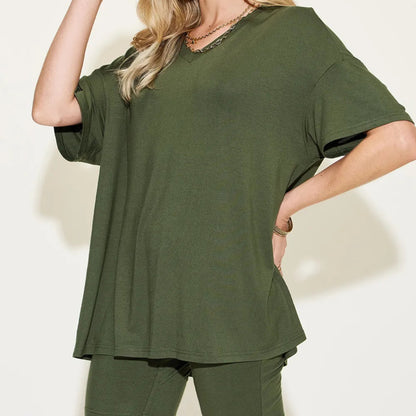 Person wearing a matcha green t-shirt and pants against a white background