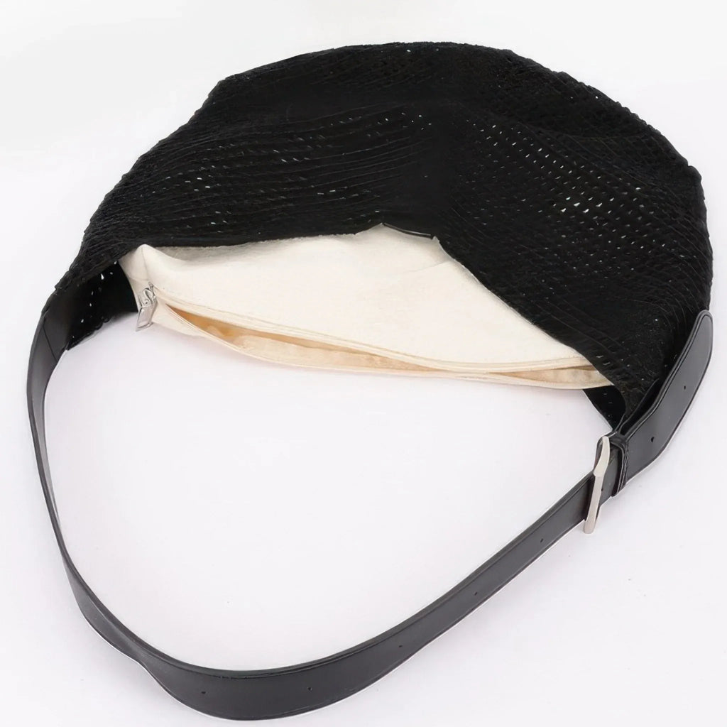 Close-up of the black mesh crochet shoulder bag displaying the removable zippered inner pouch and spacious woven interior.