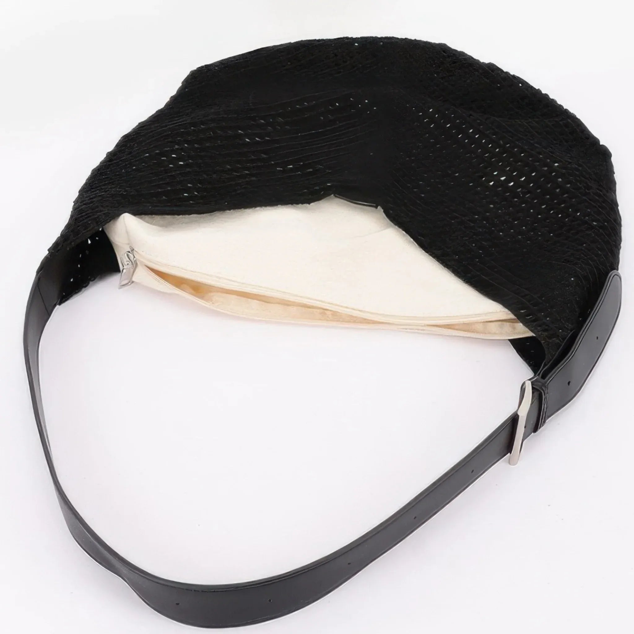 Close-up of the black mesh crochet shoulder bag displaying the removable zippered inner pouch and spacious woven interior.
