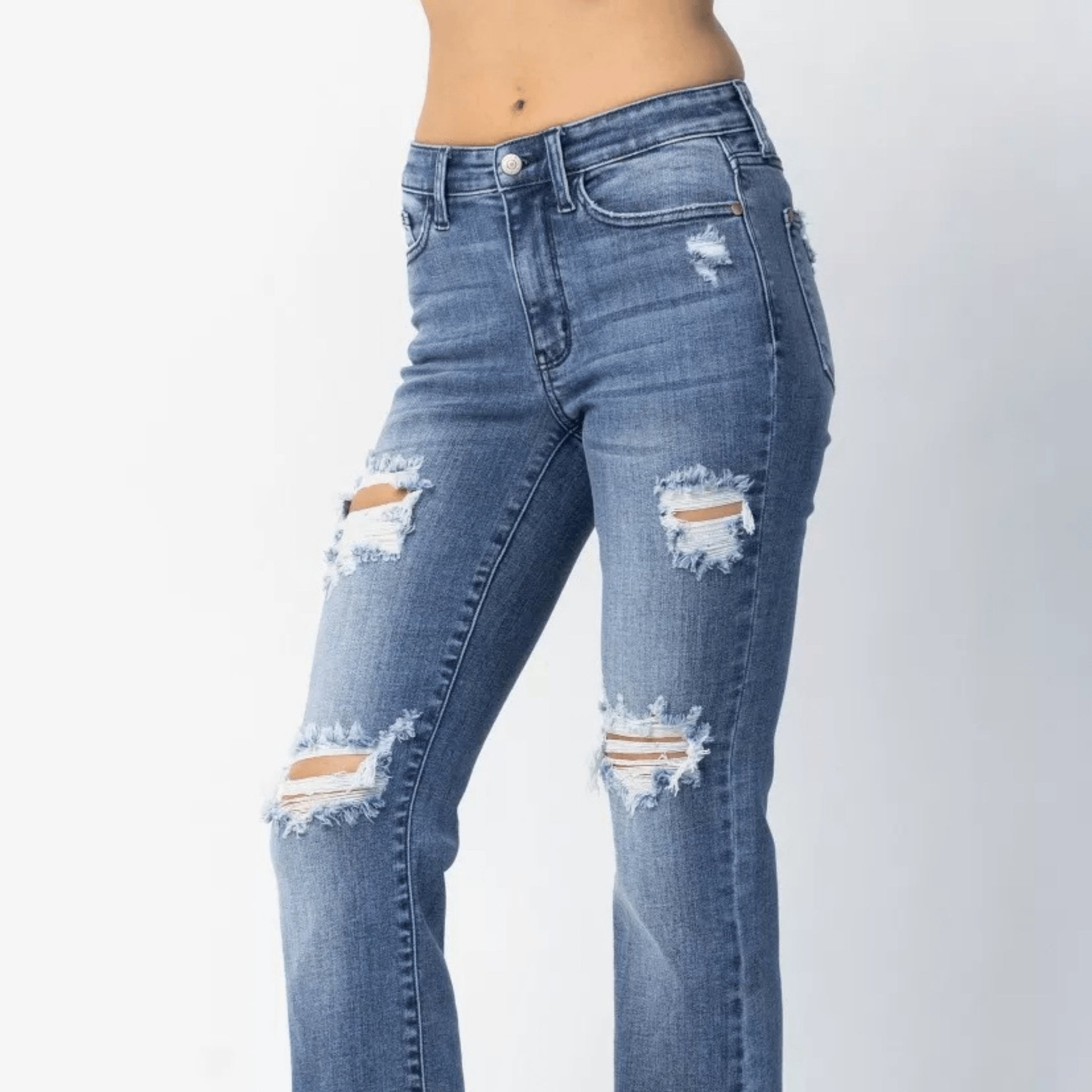 Lifestyle styling view of Judy Blue mid-rise straight leg jeans.