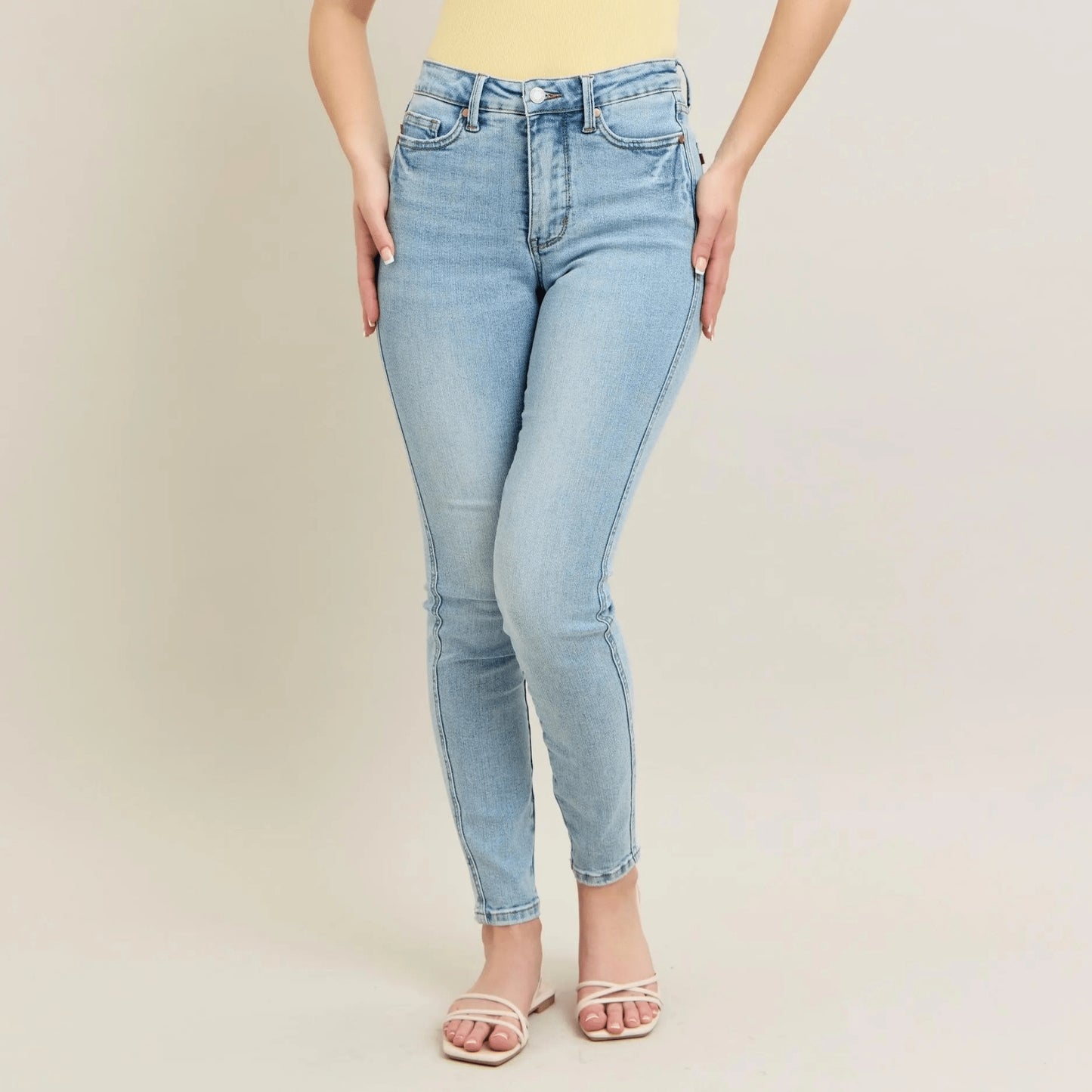 Detailed view of the vintage wash and cotton-blend fabric on light blue skinny denim.