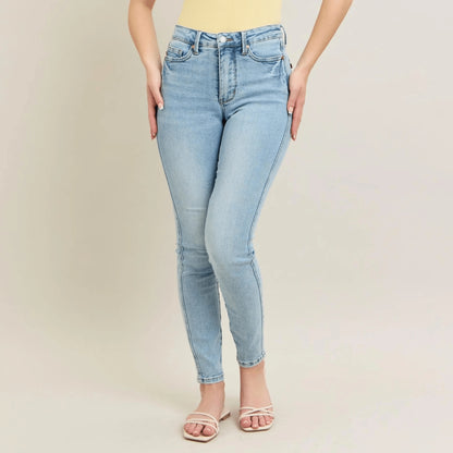 Detailed view of the vintage wash and cotton-blend fabric on light blue skinny denim.