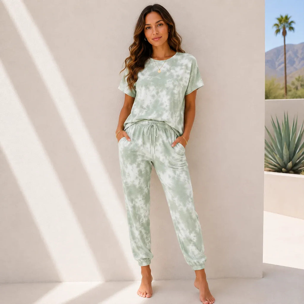 Women's mint green tie-dye two-piece lounge set with a relaxed short sleeve top and jogger pants.