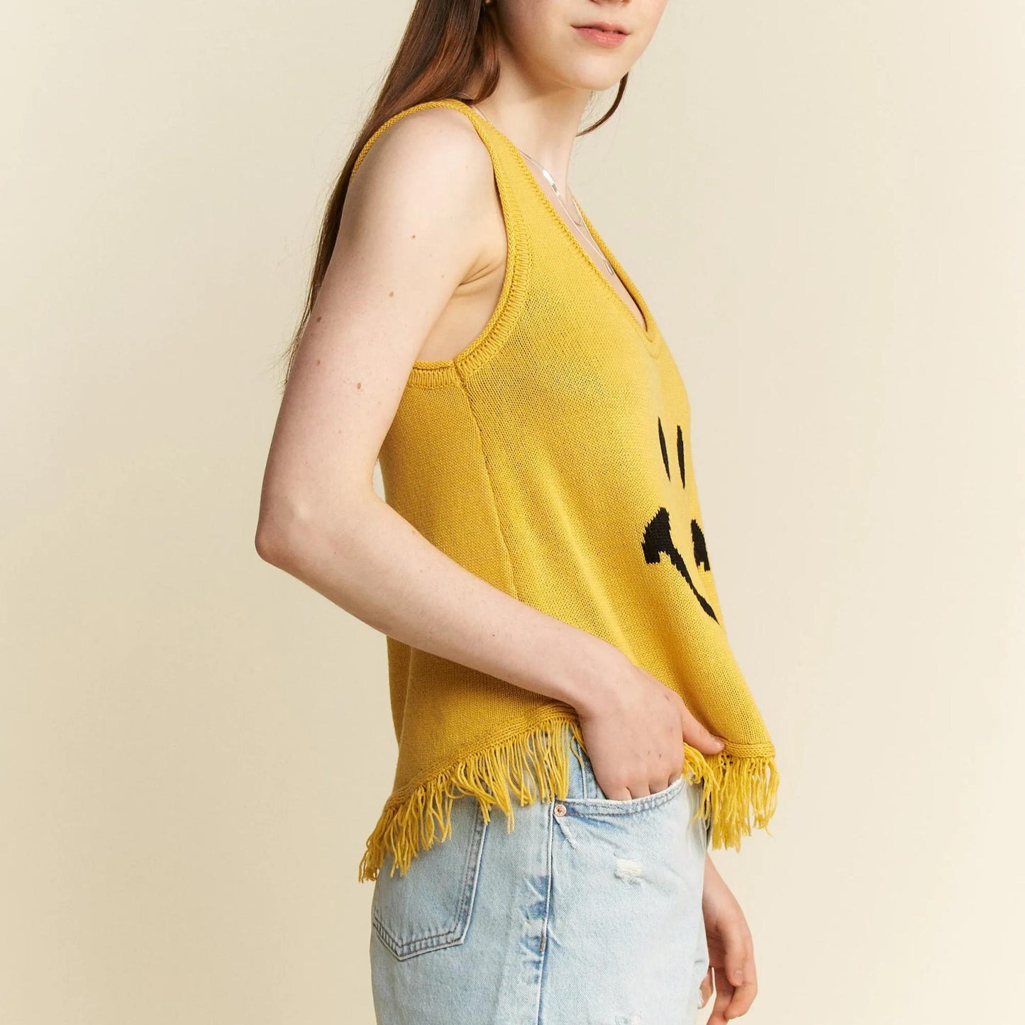 Full model view of the Jade By Jane mustard yellow smiley tank top.