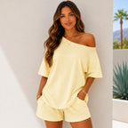 Woman wearing the Off-Shoulder Lounge Top & Shorts 2-Piece Set in apricot with a relaxed oversized fit and matching shorts.