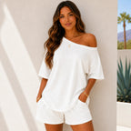 Woman wearing the Off-Shoulder Lounge Top & Shorts 2-Piece Set in white featuring a lightweight relaxed fit and matching shorts.