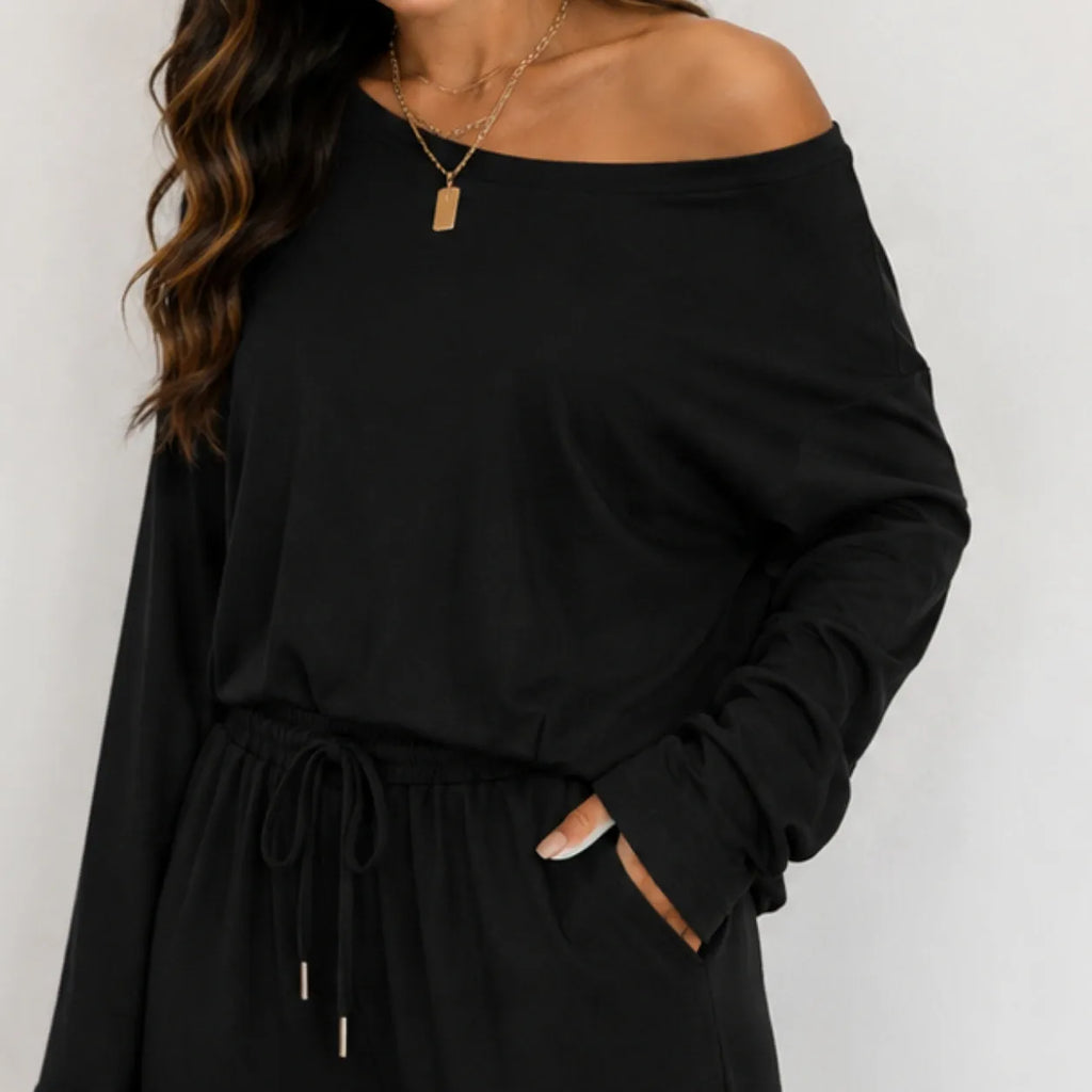 Close-up of black off-shoulder top and drawstring wide-leg pants set