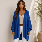 Women's royal blue oversized open front long cardigan with textured sleeves, soft chenille knit, and an open front design.