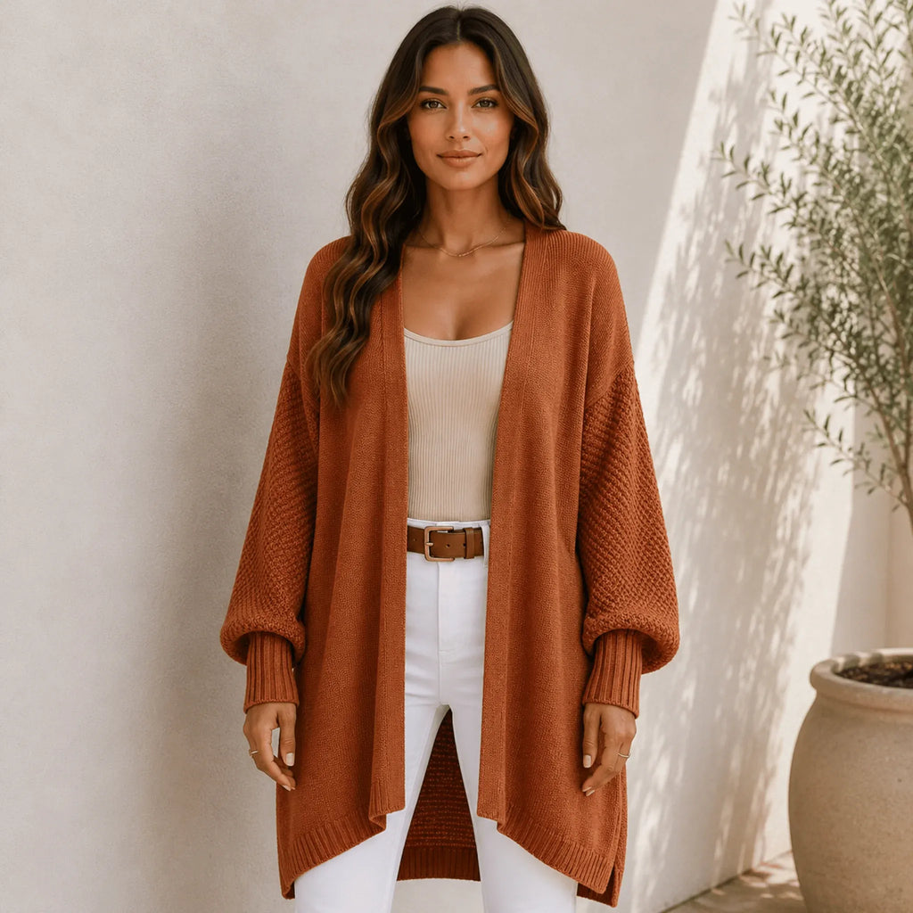 Women's brown oversized open front long cardigan featuring a longline fit, textured knit sleeves, and ultra-soft chenille fabric.