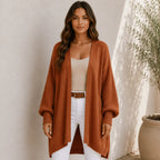Women's brown oversized open front long cardigan featuring a longline fit, textured knit sleeves, and ultra-soft chenille fabric.