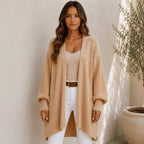 Women's camel oversized open front long cardigan with textured balloon sleeves, ribbed cuffs, and a cozy longline silhouette.