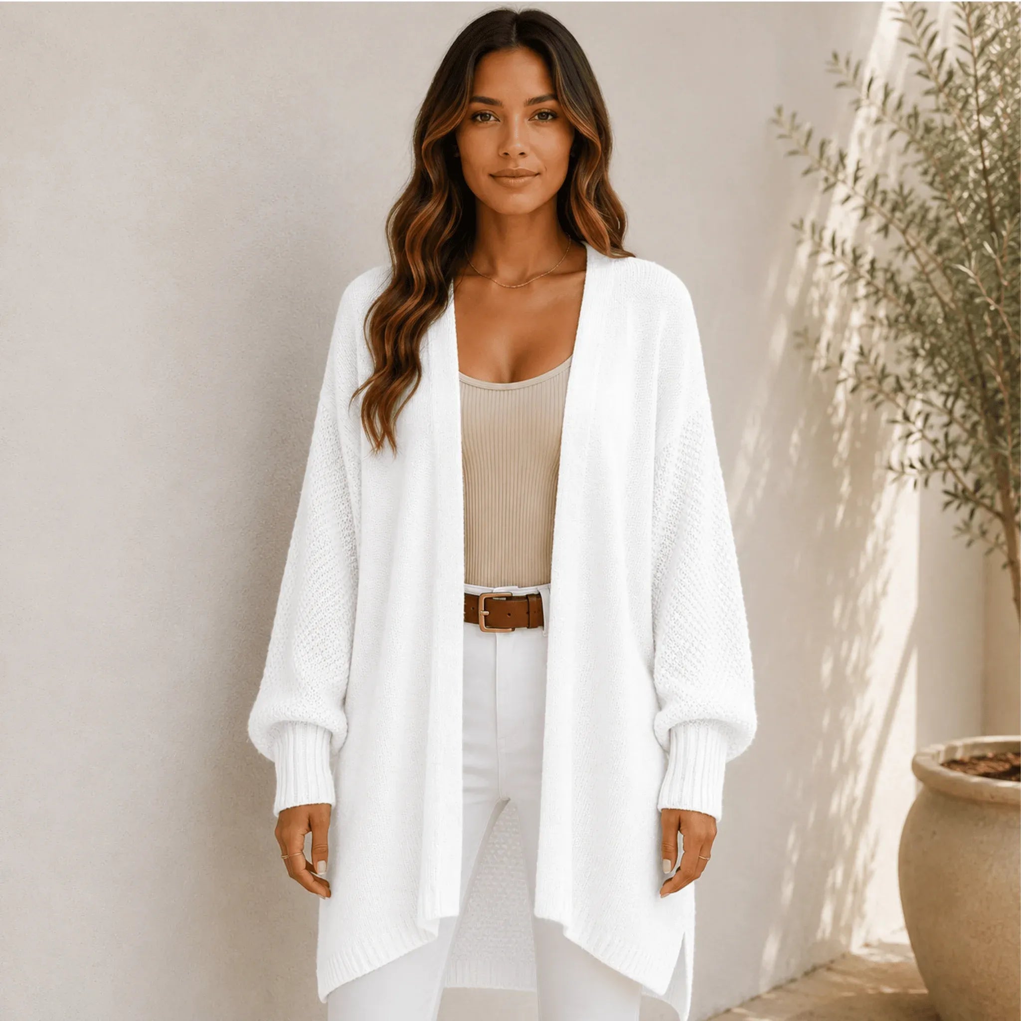 Women's white oversized open front long cardigan with textured knit sleeves, relaxed fit, and longline silhouette.