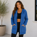 Women's oversized blue zip-up hooded jacket with front pockets