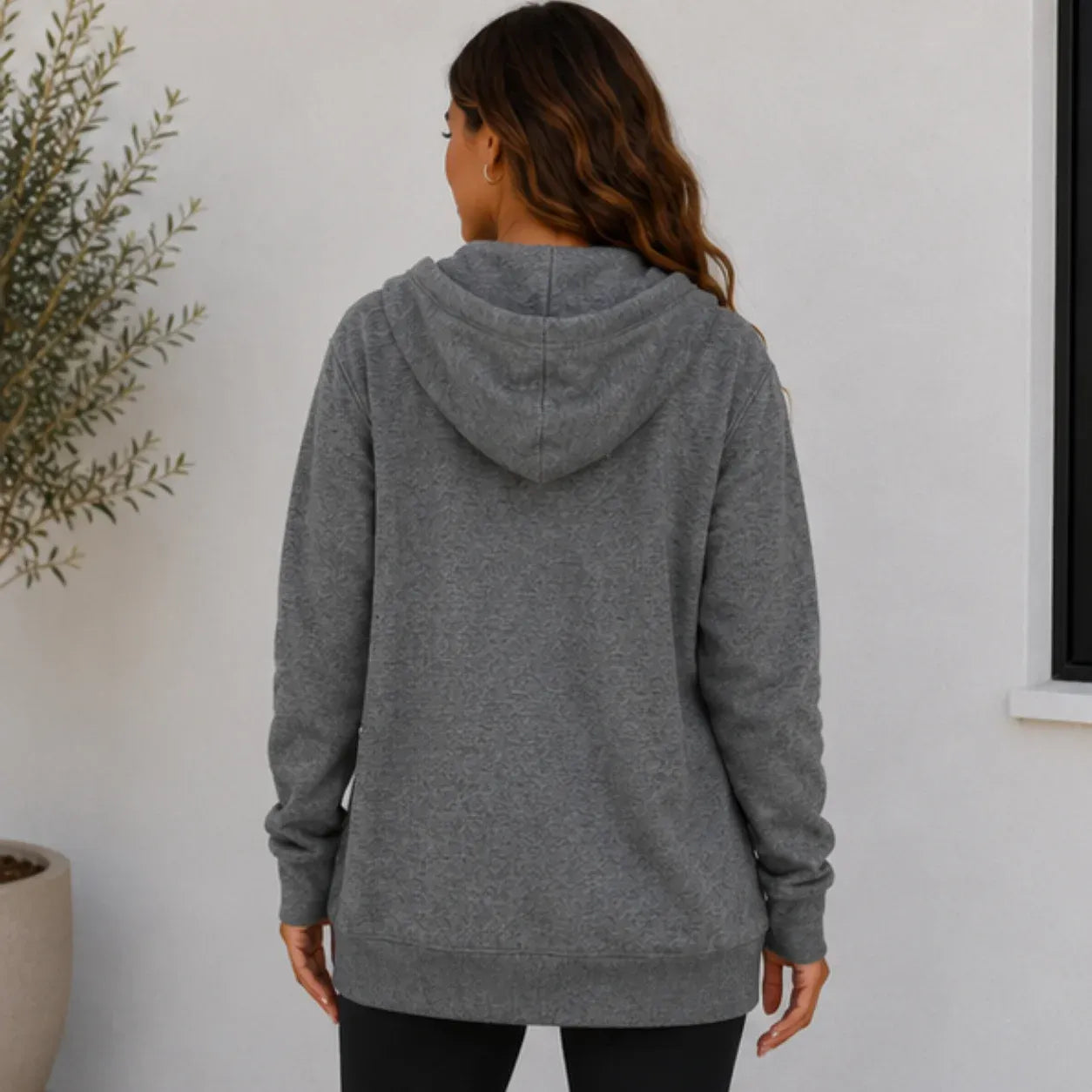 Women's oversized gray zip-up hooded jacket back view