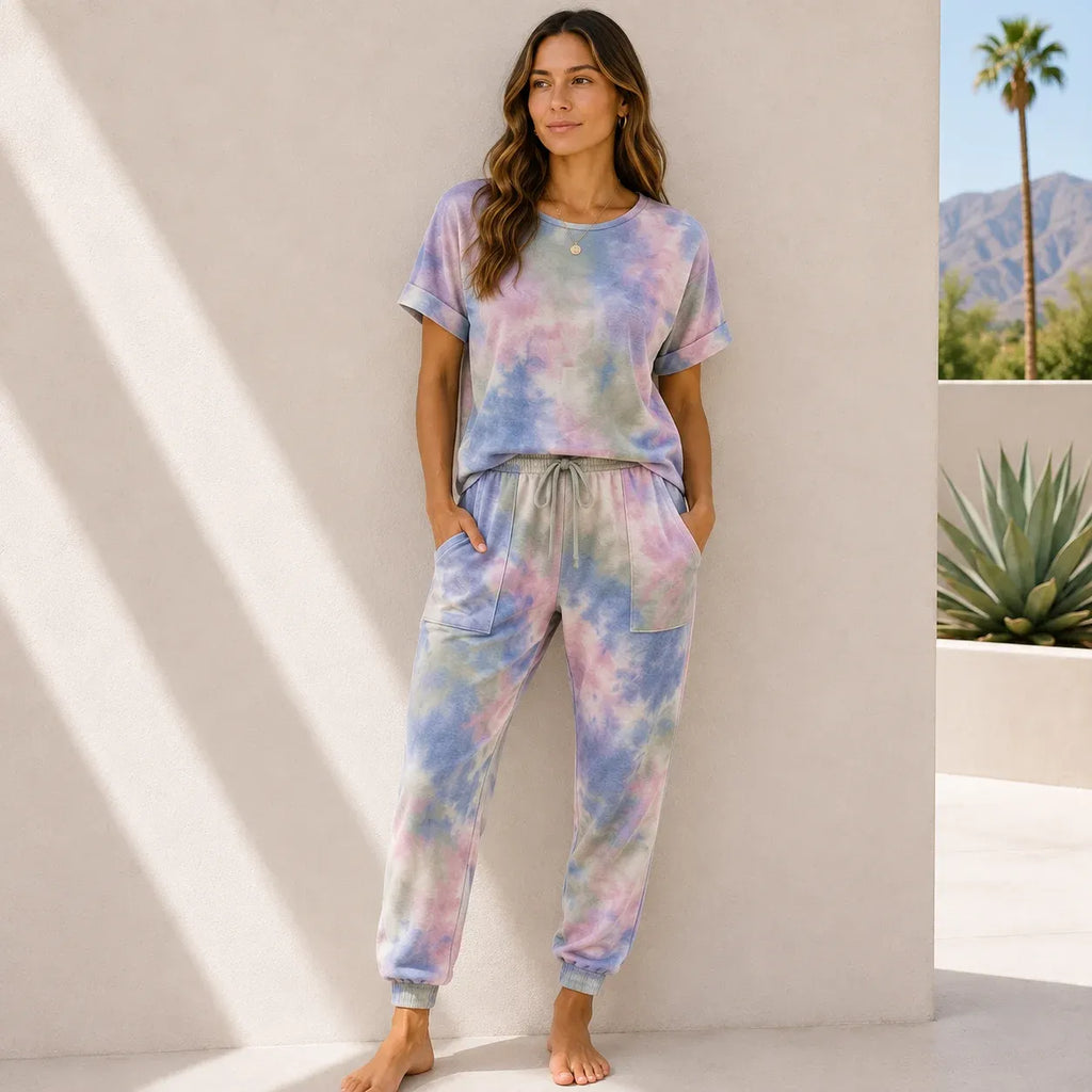 Women's pastel desert-inspired tie-dye lounge set with soft pink, lavender, and sage hues.