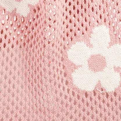 Close up view of the Fame Flower knitted shoulder bag showcasing the comfortable strap and spacious design.