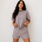 Model wearing pink and dark green horizontal striped short-sleeve two-piece lounge shorts set