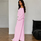 Pink women's two-piece wide-leg pants set shown from the side