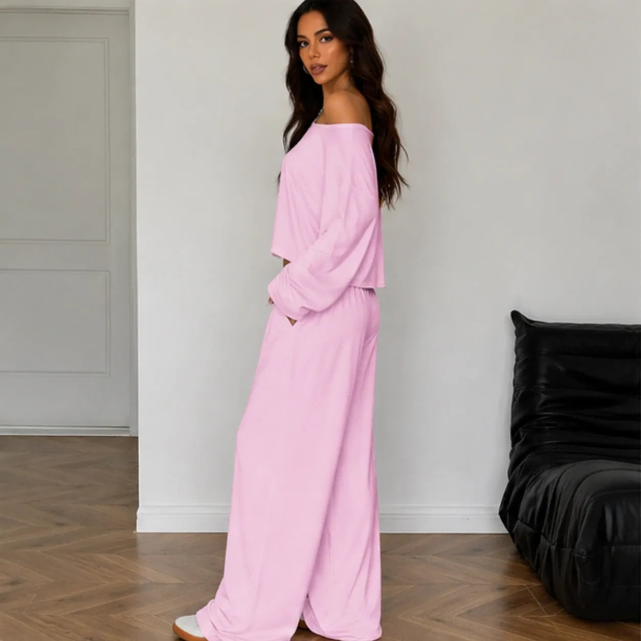 Pink women's two-piece wide-leg pants set shown from the side