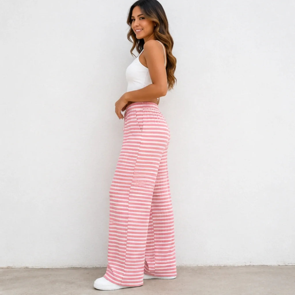 Side view of pink and white striped drawstring straight-leg pants
