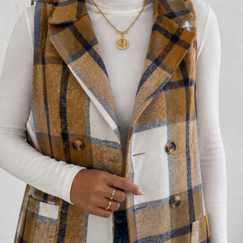 Close-up of camel plaid double-breasted long vest with button details and pockets