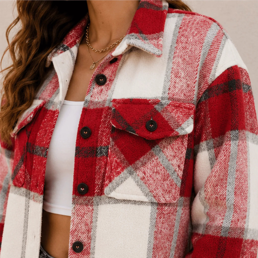 Close-up of the women's wine red plaid flannel button-up jacket highlighting the soft brushed fabric, button-front closure, chest pocket, and classic plaid pattern.