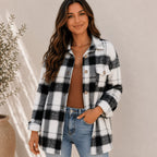 Women's black plaid flannel button-up jacket with a loose fit, shirt collar, chest flap pockets, and button-front closure.