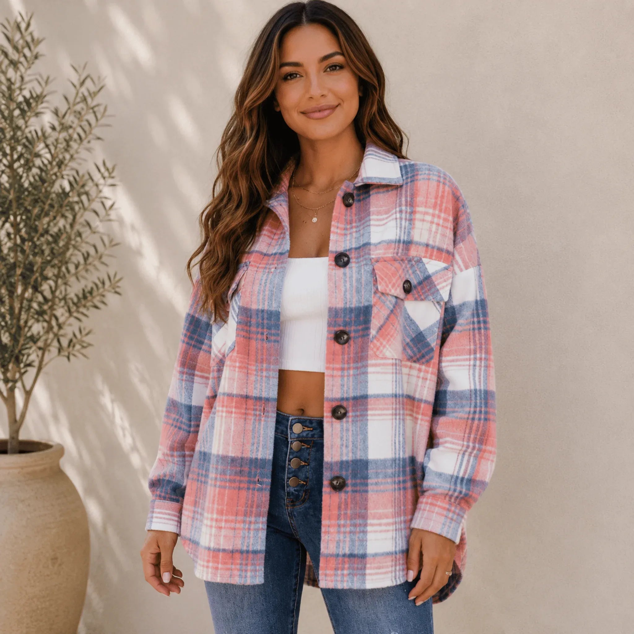 Women's blue pink plaid flannel button-up jacket featuring an oversized fit, button-front closure, long sleeves, and classic plaid pattern.