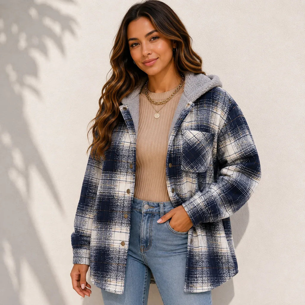 Woman wearing a blue plaid sherpa-lined hooded shacket