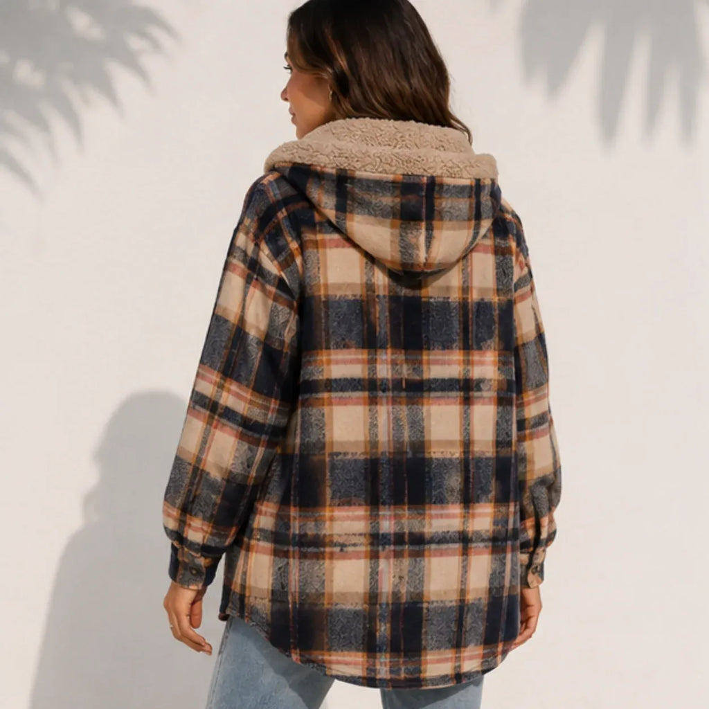 Back view of a woman wearing a brown plaid sherpa-lined hooded shacket