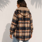 Back view of a woman wearing a brown plaid sherpa-lined hooded shacket