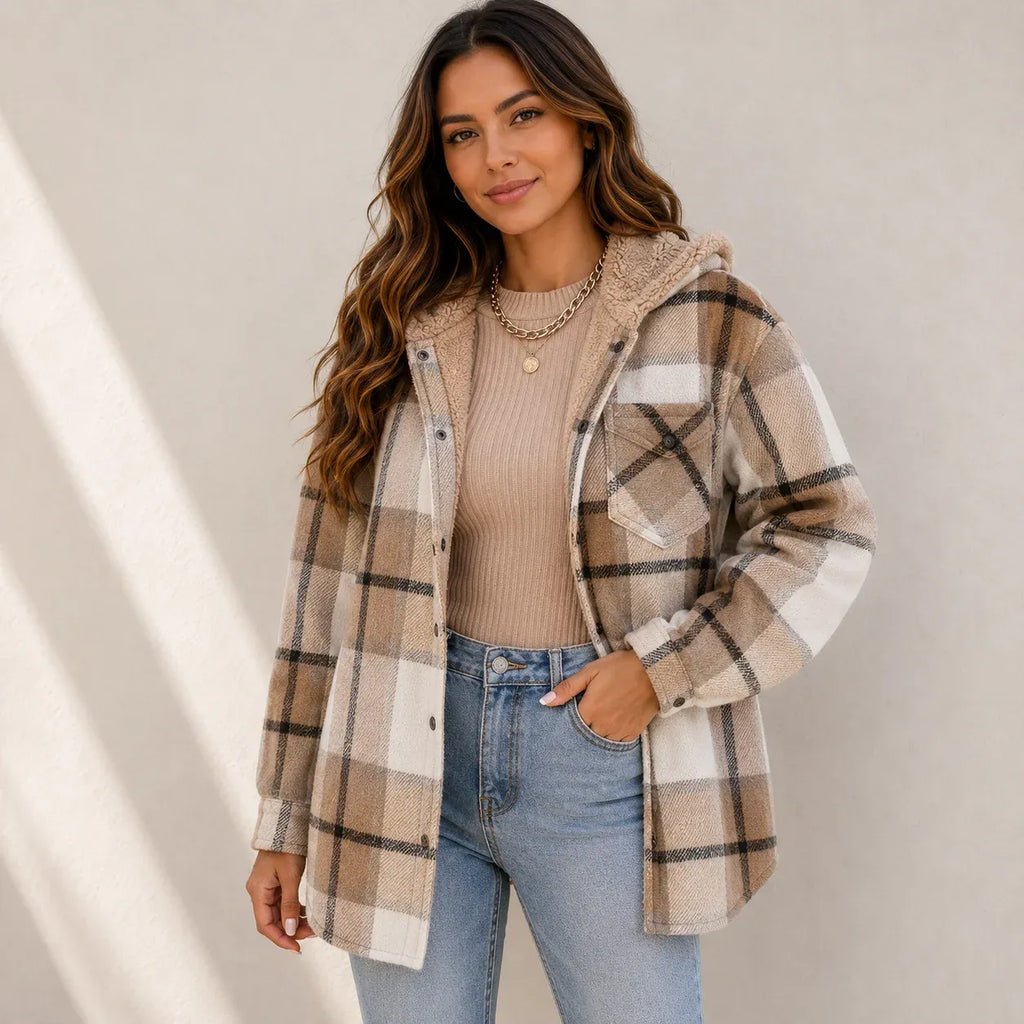 Woman wearing a khaki plaid sherpa-lined hooded shacket