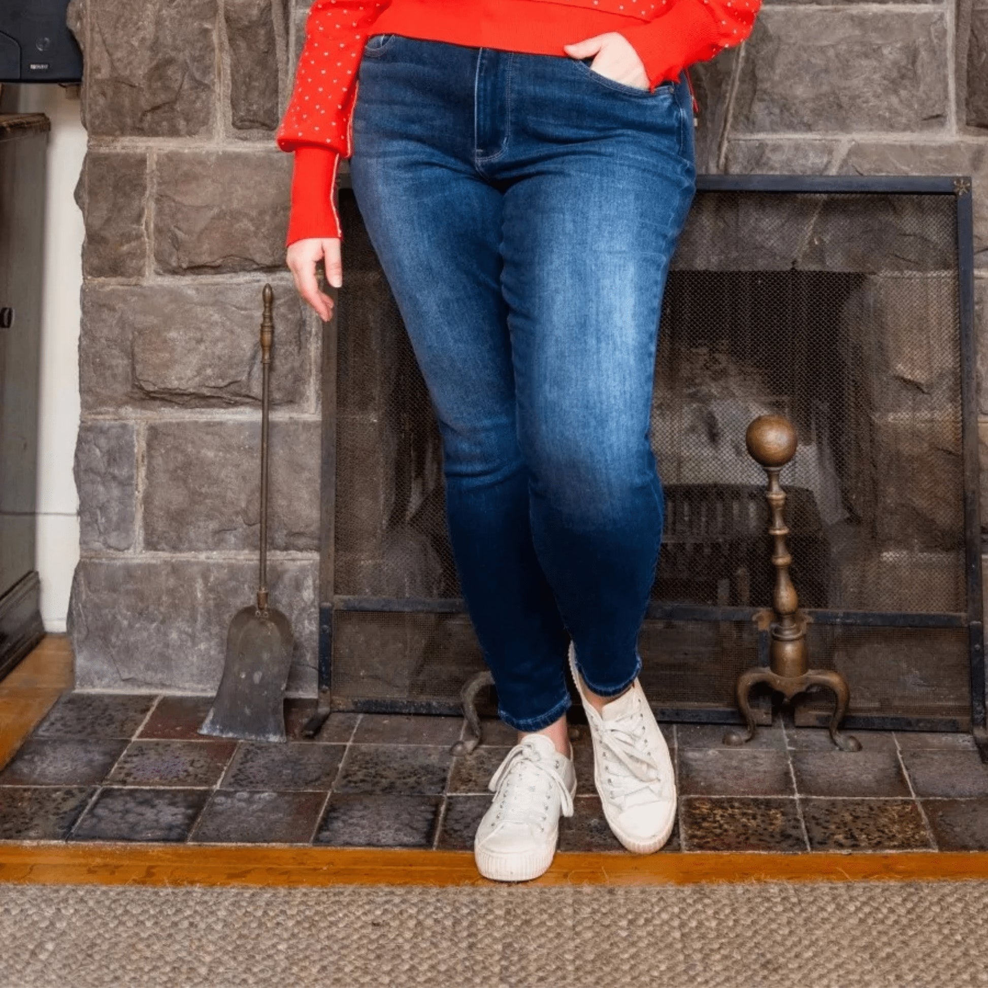 Front view of plus size thermal skinny jeans highlighting the sculpting high-rise fit and clean front.