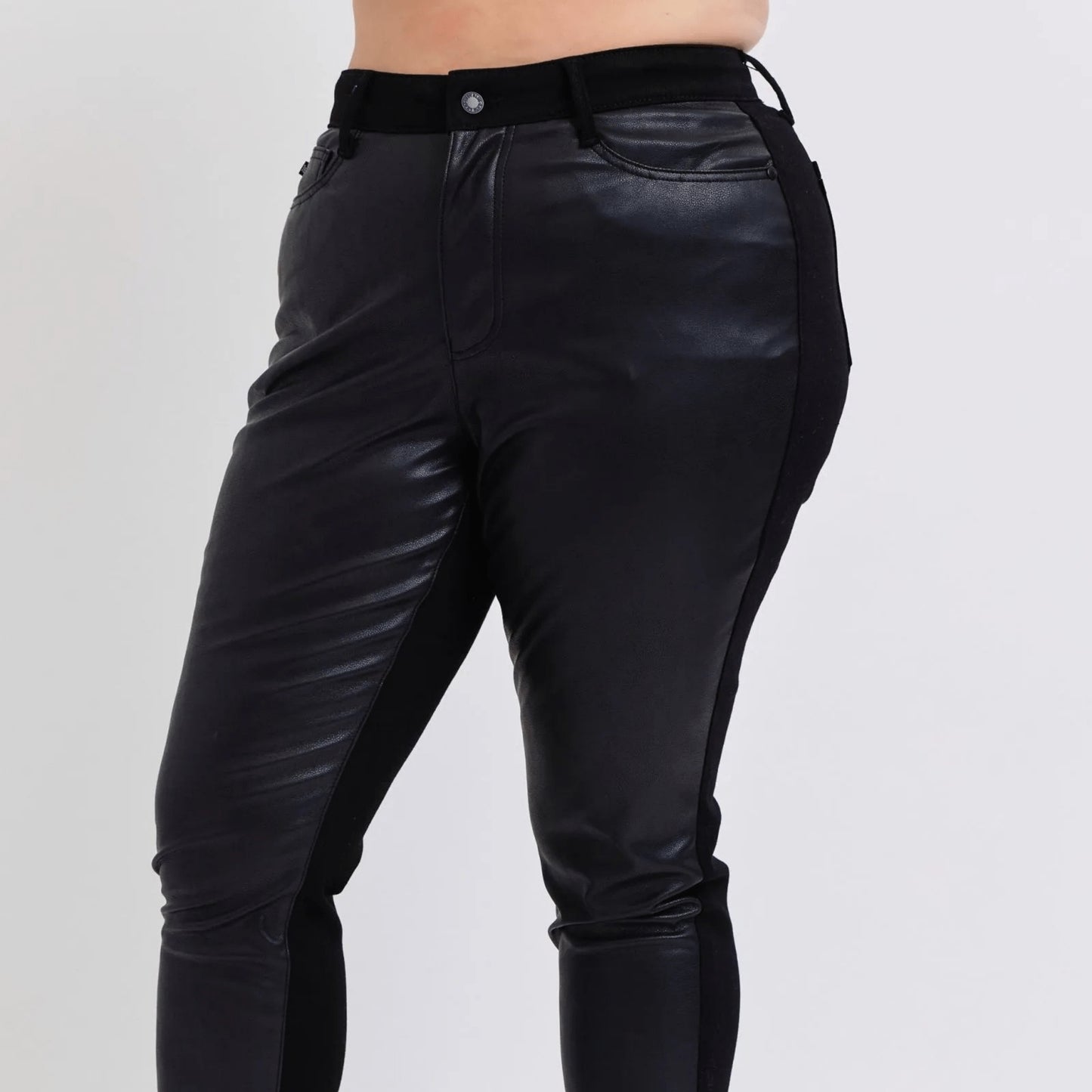 Front view of Judy Blue plus size faux leather pants showing the classic 5-pocket design.