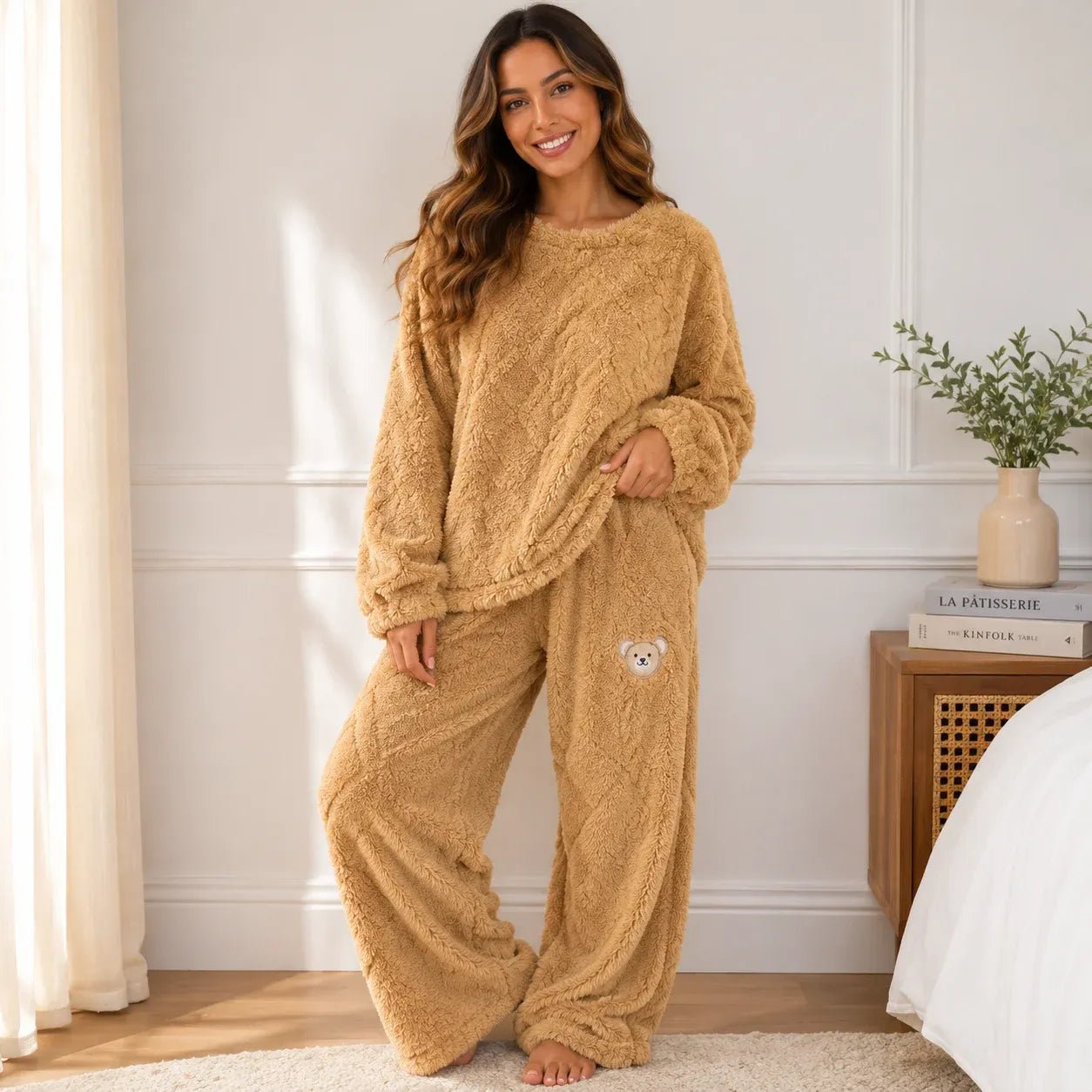 Woman wearing a cozy yellow plush fleece pajama set with long sleeves and wide-leg pants