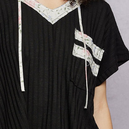 POL black short sleeve hooded top with hood and pocket — detail close-up.